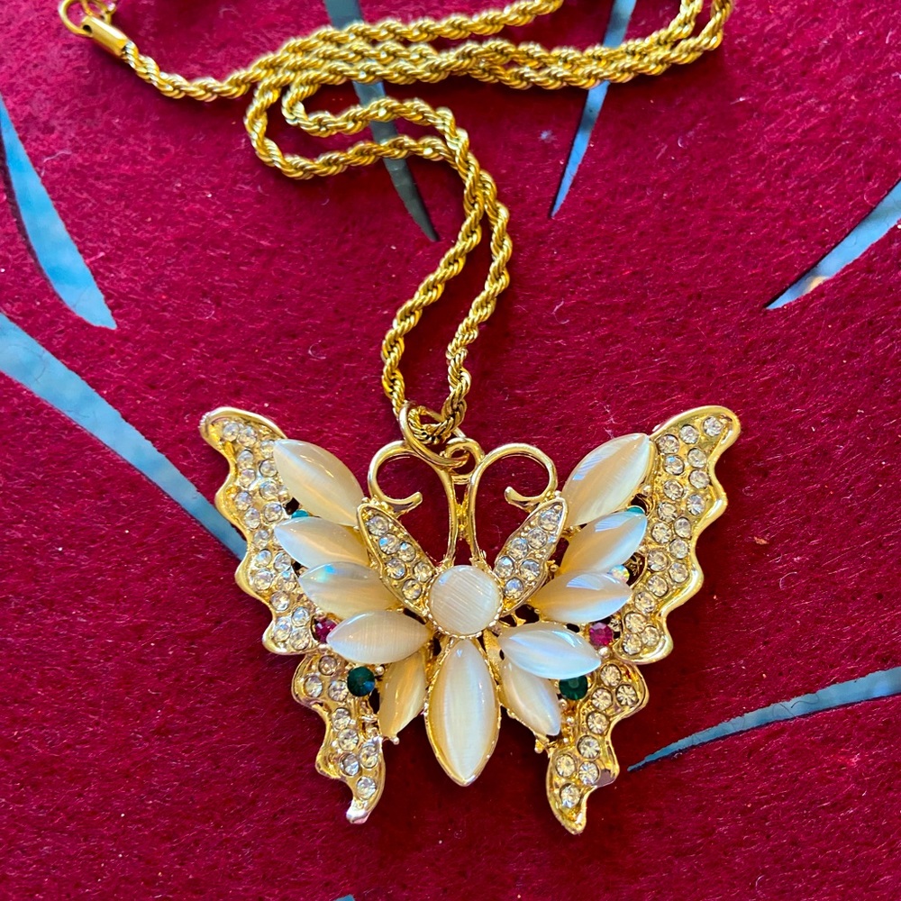 Beautiful brand new soft, gold butterfly pendant.